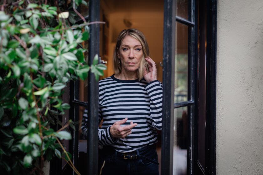 Kim Gordon photographed at a doorway to her home in Los Feliz.