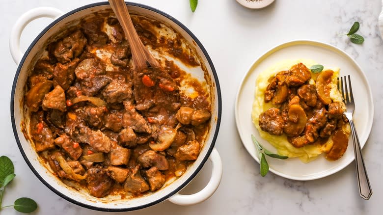 braised pork and apple casserole served over mashed potatoes