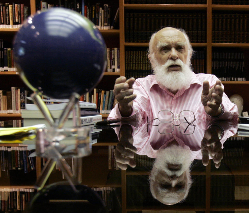 FILE - In this Friday, June 29, 2007, file photo, James Randi talks to a reporter in Fort Lauderdale, Fla. Magician Randi, whose daring escapes were later eclipsed by his work as the country’s foremost skeptic, has died. The Florida-based James Randi Educational Foundation announced its founder died Monday, Oct. 19, 2020, at 92. (AP Photo/Alan Diaz)