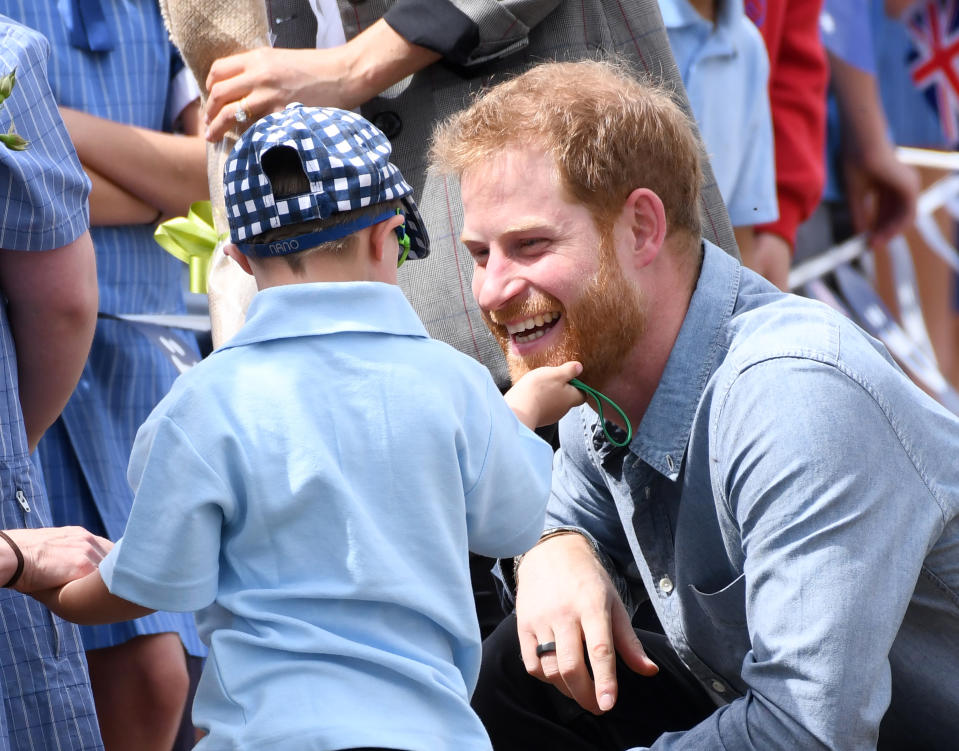 Prince Harry Duke of Sussex and Meghan Duchess of Sussex arrive at Dubbo Airport where they meet Luke Vincent, 5, from Buninyong Public School Kindergarten, New South Wales, Australia. Photo credit should read: Doug Peters/EMPICS