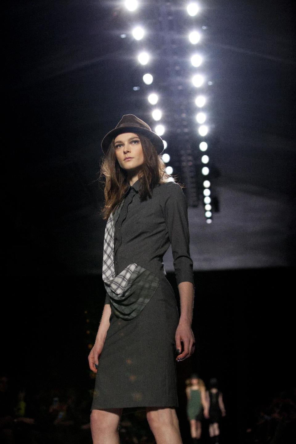 A model walks the runway during the Nicole Miller Fall 2013 fashion show during Fashion Week, Friday, Feb. 8, 2013, in New York. (AP Photo/Karly Domb Sadof)