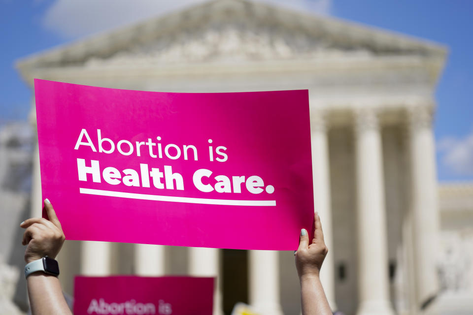 Demonstrators hold signs as they rally outside the Supreme Court building during the Women's March in Washington, Saturday, June 24, 2023. Abortion rights and anti-abortion activists held rallies Saturday in Washington and across the country to call attention to the Dobbs v. Jackson Women's Health Organization ruling on June 24, 2022, which upended the 1973 Roe v. Wade decision. (AP Photo/Stephanie Scarbrough)