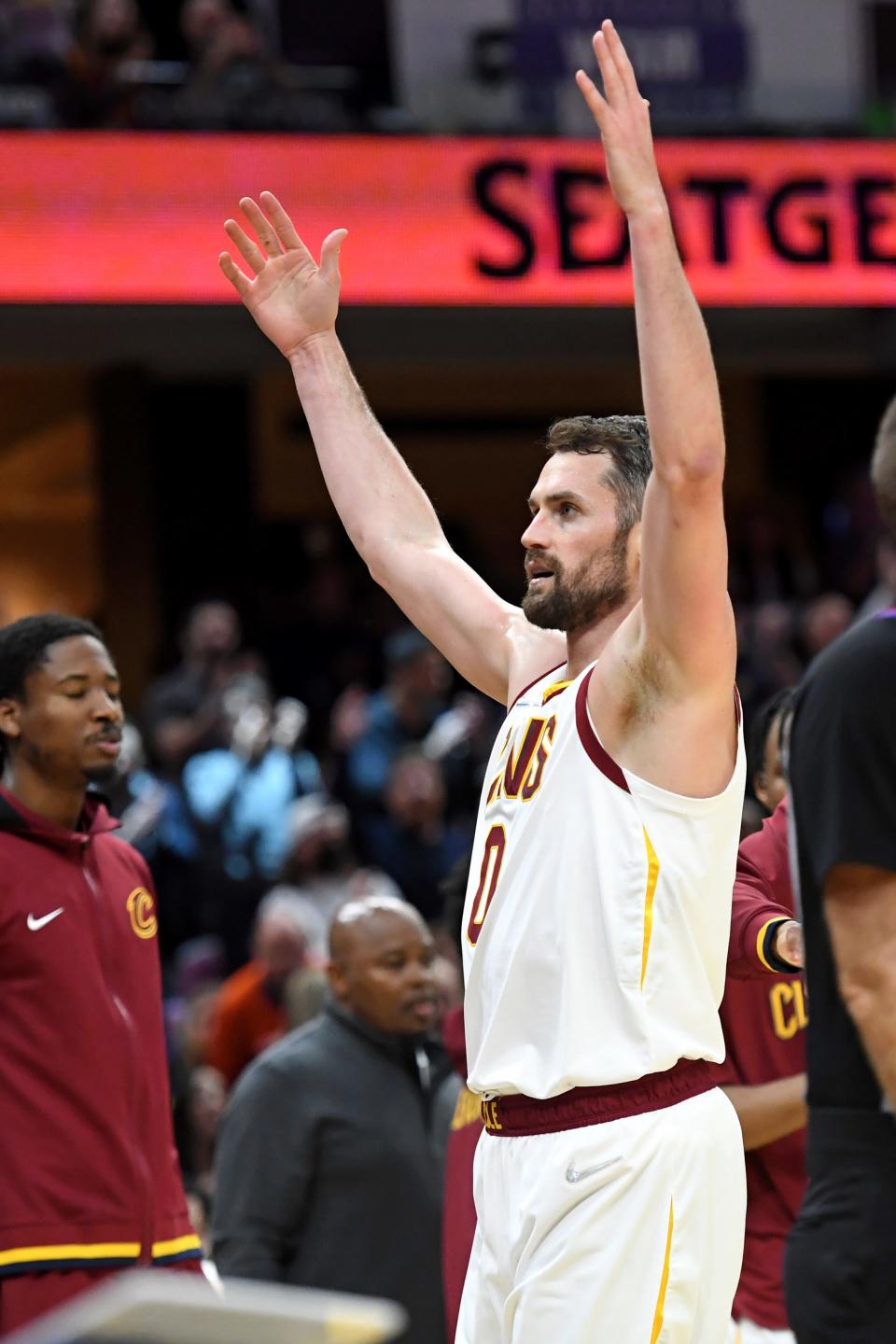 Cleveland Cavaliers forward Kevin Love (0) celebrates making a 3-point basket in the second half of an NBA basketball game against the Detroit Pistons, Saturday, March 19, 2022, in Cleveland. (AP Photo/Nick Cammett)