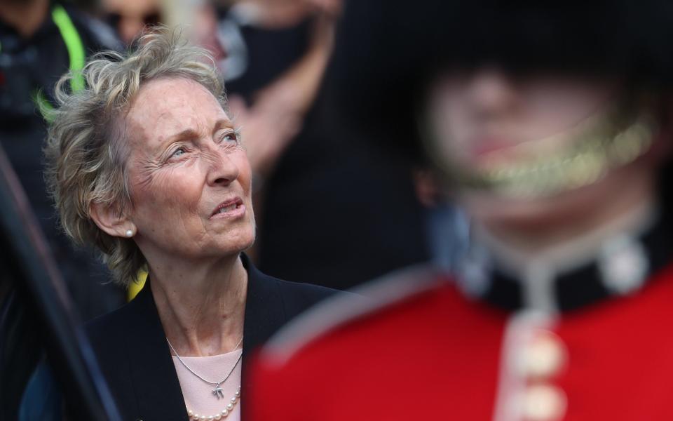 Virginia Lewis-Jones follows her mother's funeral cortege as it passes through the village of Ditchling, East Sussex - PA