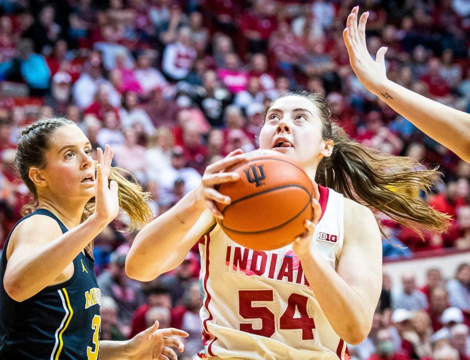 Indiana's Mackenzie Holmes (54) shoots over Michigan's Emily Kiser (33) during the second half of the Indiana versus Michigan women's basketball game at Simon Skjodt Assembly Hall on Thursday, Feb. 16, 2023.