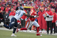Kansas City Chiefs' Patrick Mahomes runs for a touchdown past Tennessee Titans linebacker Rashaan Evans (54) during the first half of the NFL AFC Championship football game Sunday, Jan. 19, 2020, in Kansas City, MO. (AP Photo/Ed Zurga)