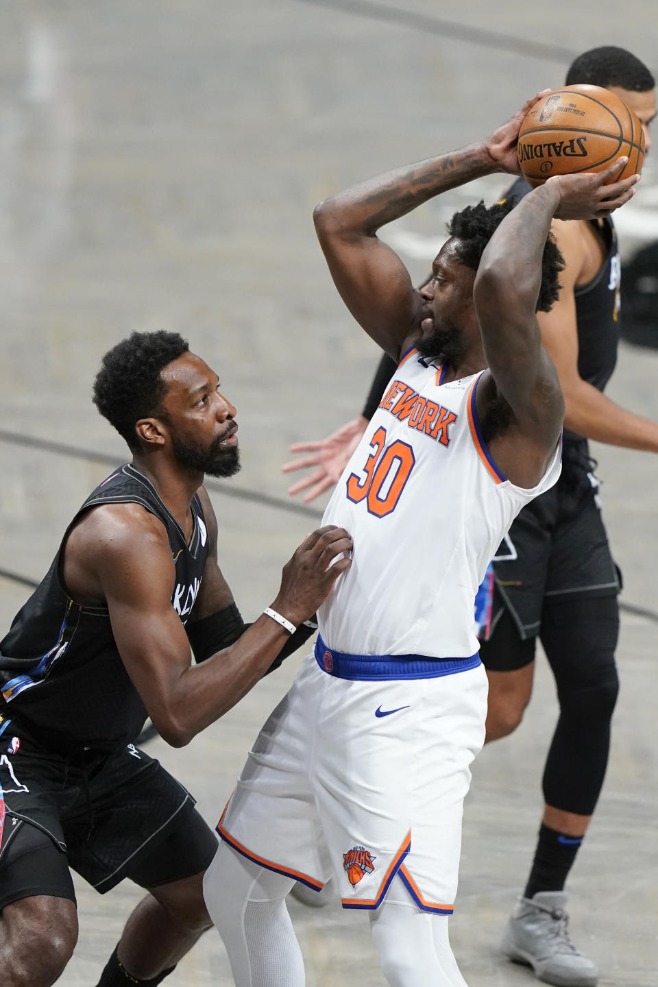 Brooklyn Nets' Jeff Green, left, defends New York Knicks' Julius Randle (30) during the second half of an NBA basketball game Monday, April 5, 2021, in New York. (AP Photo/Frank Franklin II)