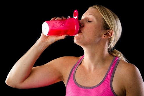 <span class="caption">A lack of research means we still know very little about whether pre-workout supplements work.</span> <span class="attribution"><a class="link " href="https://www.shutterstock.com/image-photo/workout-woman-pink-top-drinking-energy-1812888592" rel="nofollow noopener" target="_blank" data-ylk="slk:Stockmedia Sweden/ Shutterstock;elm:context_link;itc:0;sec:content-canvas">Stockmedia Sweden/ Shutterstock</a></span>