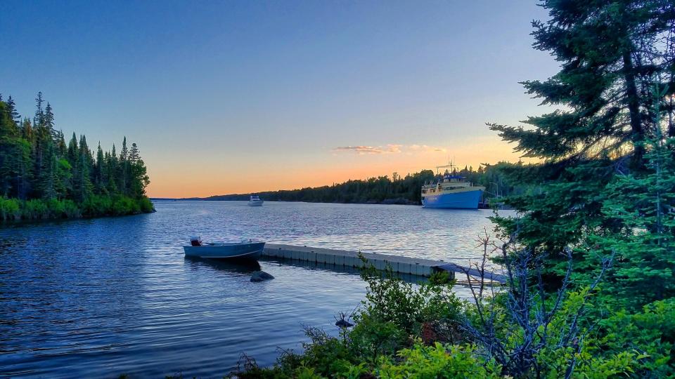 The Ranger III boat docked during sunset is seen from Rock Harbor.