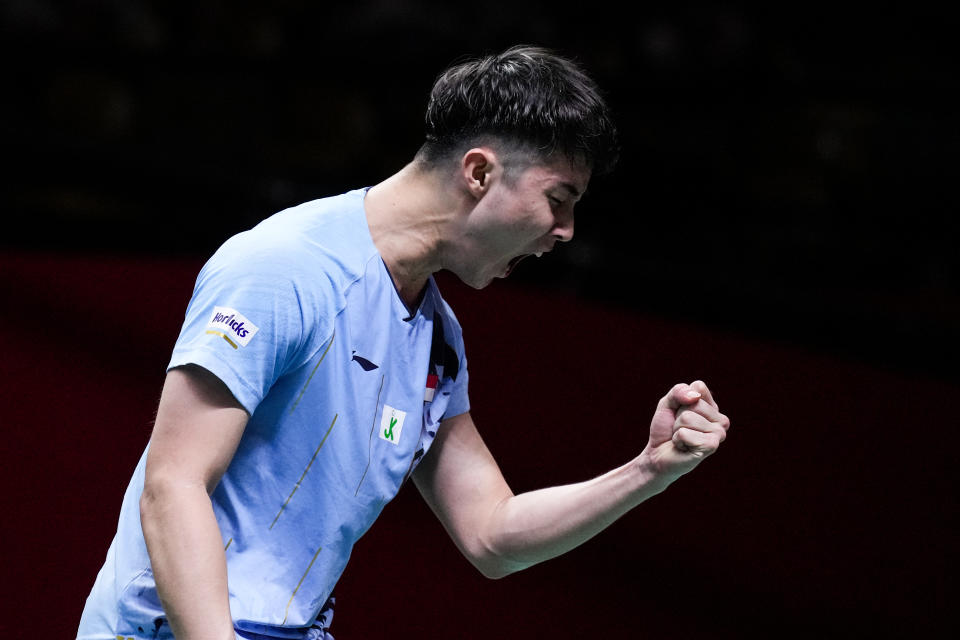 Singapore shuttler Loh Kean Yew pumps his fist after clinching a point. 