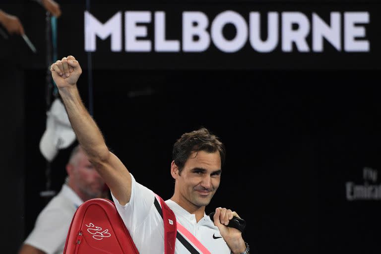 Switzerland&apos;&apos;s Roger Federer waves after South Korea&apos;&apos;s Chung Hyeon retired from their men&apos;&apos;s singles semi-finals match on day 12 of the Australian Open tennis tournament in Melbourne