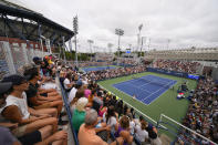 Tennis fans watch play during the first round of the U.S. Open tennis championships, Monday, Aug. 28, 2023, in New York. (AP Photo/Manu Fernandez)