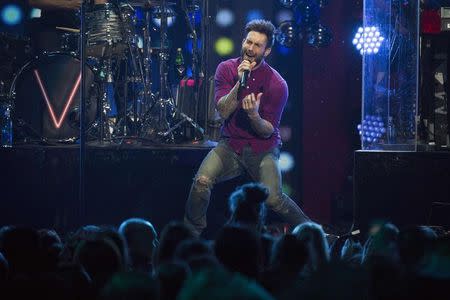 Adam Levine and Maroon 5 perform at the Z100's Jingle Ball 2014 at Madison Square Garden in New York in this December 12, 2014 file photo. REUTERS/Andrew Kelly/Files