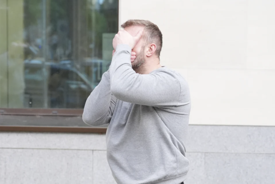 After Trickett was released on bail during his court appearance, he hid his face in his hands to avoid the media cameras.