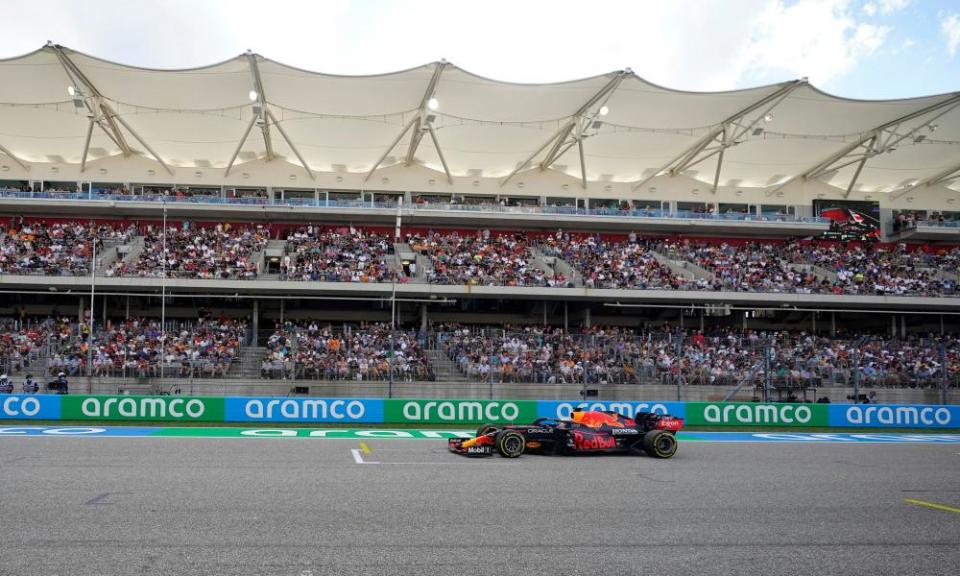 Max Verstappen races past grandstands containing plenty of his orange-clad supporters