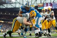 Detroit Lions defensive tackle Ndamukong Suh (90) sacks Green Bay Packers quarterback Matt Flynn (10) in the end zone for a safety during the third quarter during a NFL football game on Thanksgiving at Ford Field. Mandatory Credit: Tim Fuller-USA TODAY Sports