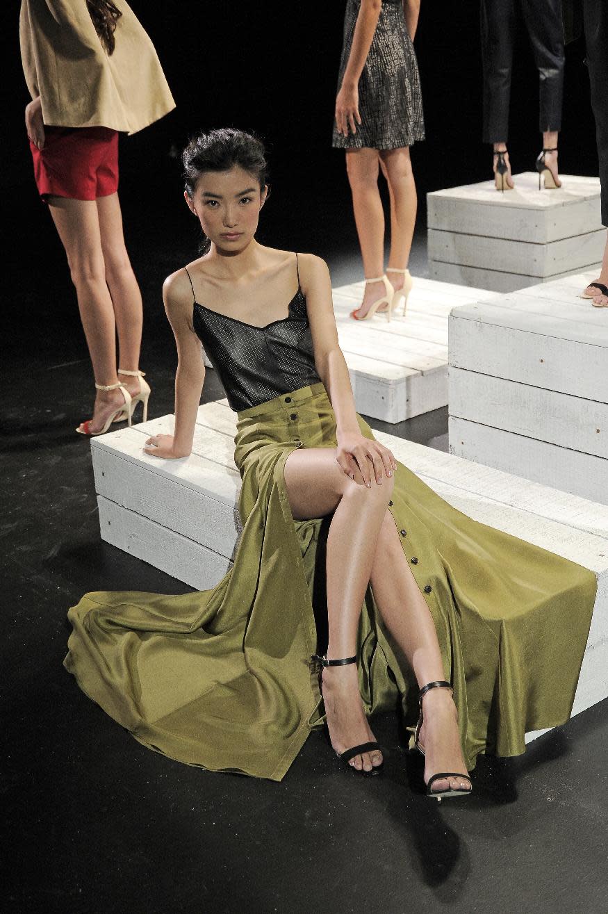 In this photo provided by Holmes & Yang, the Holmes & Yang Spring 2013 collection is modeled during Fashion Week in New York, Tuesday, Sept. 11, 2012. (AP Photo/Holmes & Yang, Dan Ashby)