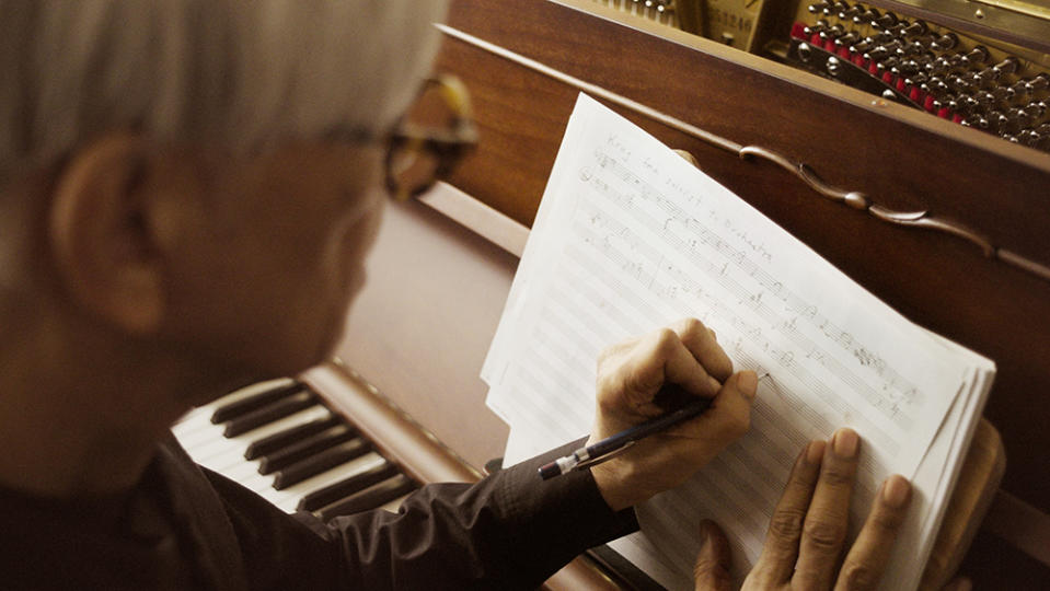 Ryuichi Sakamoto working on his composition. - Credit: Krug