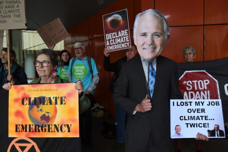 A protester wearing a mask of former Liberal prime minister Malcolm Turnbull demonstrates outside the Liberal Party's campaign launch in May 2019. Source: Getty