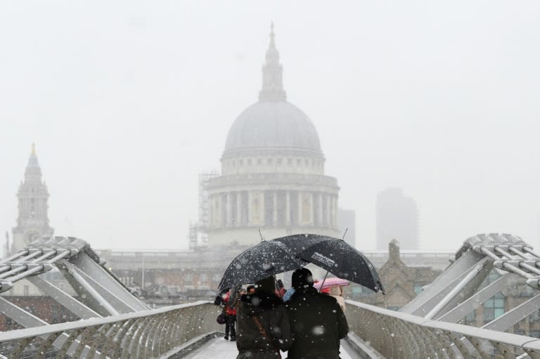 Heavy snow fell across northern and central parts of England and Wales and caused disruption to road and air travel