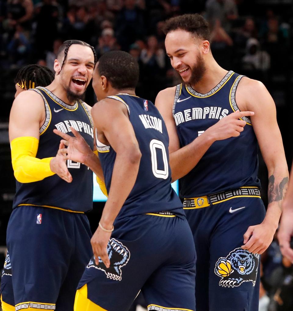 Mar 26, 2022; Memphis, Tennessee, USA;  Memphis Grizzlies guard De'Anthony Melton (0), forward Kyle Anderson (1) and forward Dillon Brooks (24) celebrate after Melton makes a three-point field goal during the second half of a game against the Milwaukee Bucks at FedExForum. The Grizzlies defeated the Bucks 127-102. Mandatory Credit: Christine Tannous-USA TODAY Sports