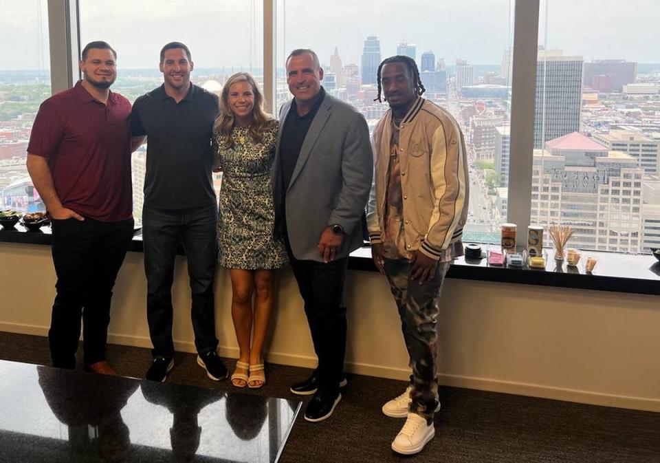 Amanda Carlo, founder of GoldGriff Athlete Agency has assembled a VIP list of clients since starting her company including (from left) former and current Kansas City Chiefs players Nick Allegretti, James Winchester, Tim Grunhard, and current Chiefs player L’Jarius Sneed. The group was attending an NFL Draft event. Courtesy photo