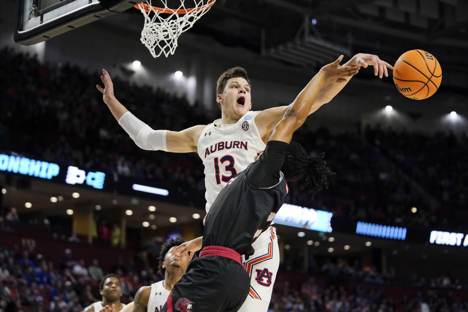 FILE - Auburn's Walker Kessler blocks Jacksonville State's Demaree King during the second half of an NCAA college basketball game in the first round of the NCAA tournament, Friday, March 18, 2022, in Greenville, S.C. Kessler is one of the top big men in this year's NBA draft. (AP Photo/Brynn Anderson, File)