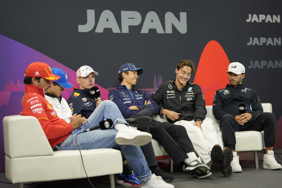 Red Bull driver Max Verstappen of the Netherlands, their left, speaks as Ferrari driver Carlos Sainz of Spain, from left, Yuki Tsunoda of Japan, driver of RB, the team previously known as AlphaTauri, Williams driver Alexander Albon of Thailand, Mercedes driver George Russell of Britain and Alpine driver Pierre Gasly of France listen during a news conference at the Suzuka Circuit in Suzuka, central Japan, Thursday, April 4, 2024, ahead of Sunday's Japanese Formula One Grand Prix. (AP Photo/Hiro Komae)