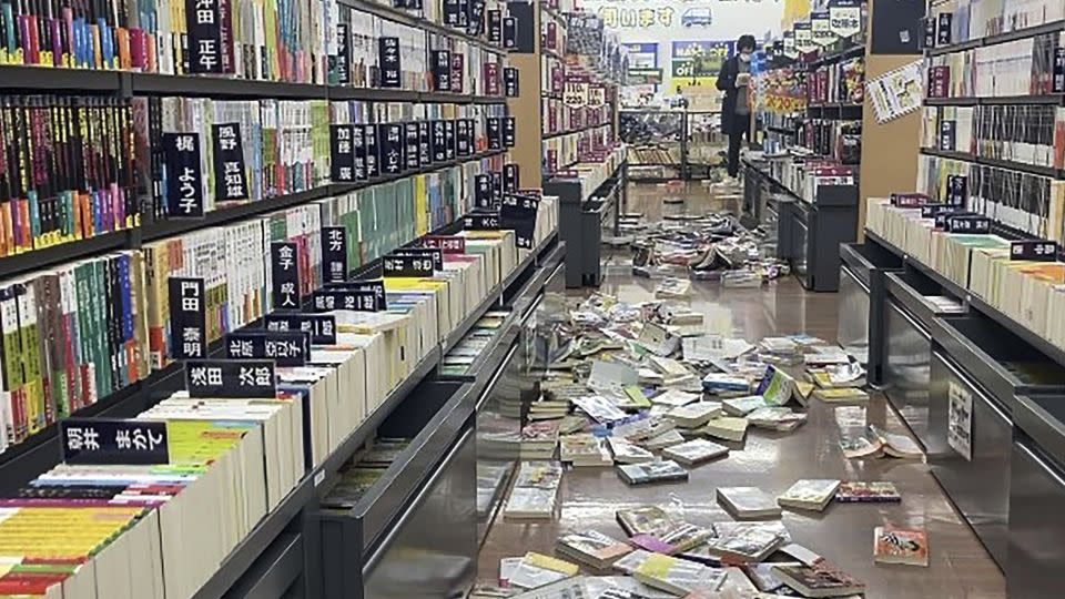 Books are scattered at a bookstore in Niigata, Japan following an earthquake Monday. - Kyodo News/AP