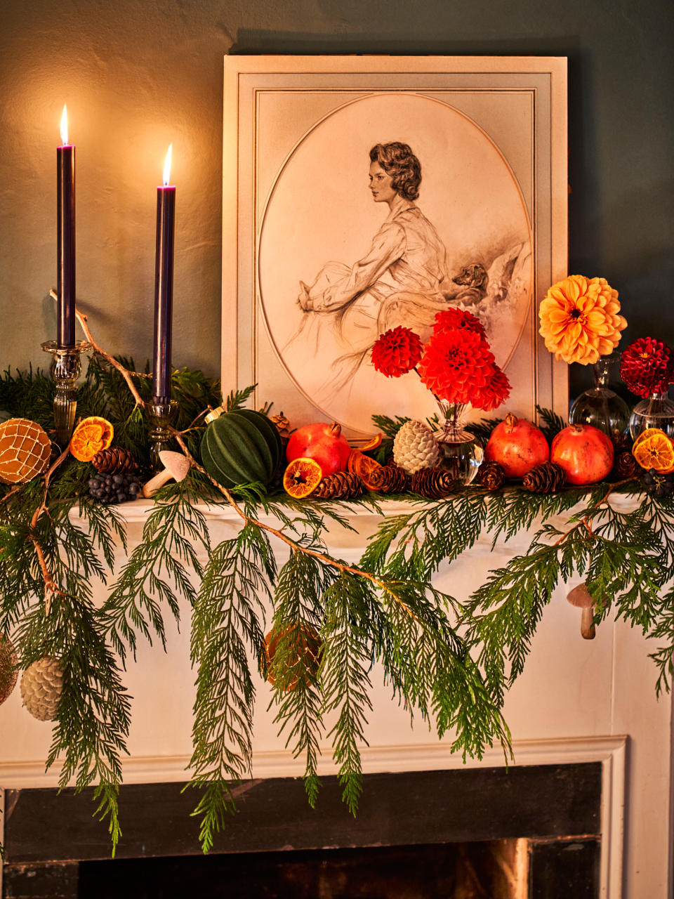 Living room mantelpiece decorated with Christmas foliage