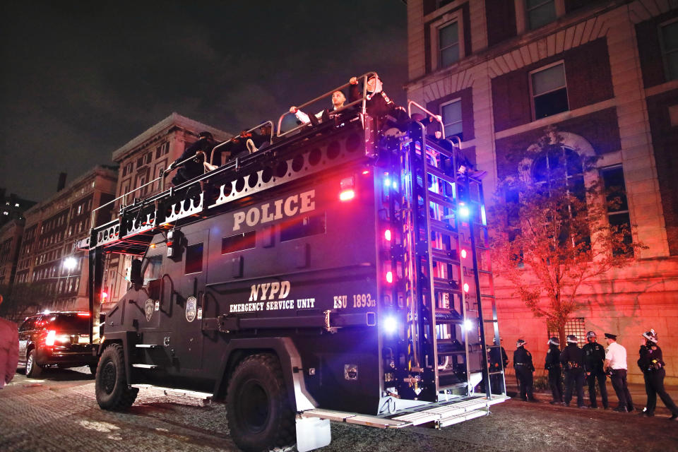 NYPD officers in riot gear arrive at Columbia University, where pro-Palestinian students are barricaded inside a building and have set up an encampment, in New York City on April 30, 2024. / Credit: KENA BETANCUR/AFP via Getty Images