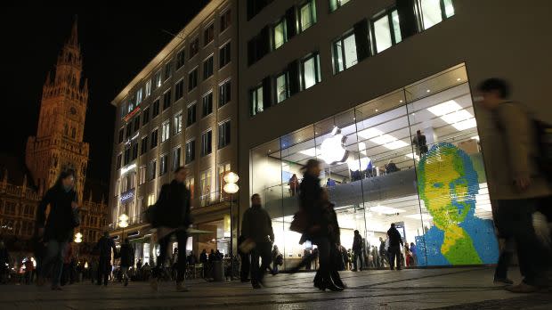 The face of Apple co-founder and former CEO Steve Jobs is created with adhesive notes on the window of an Apple Store in Munich