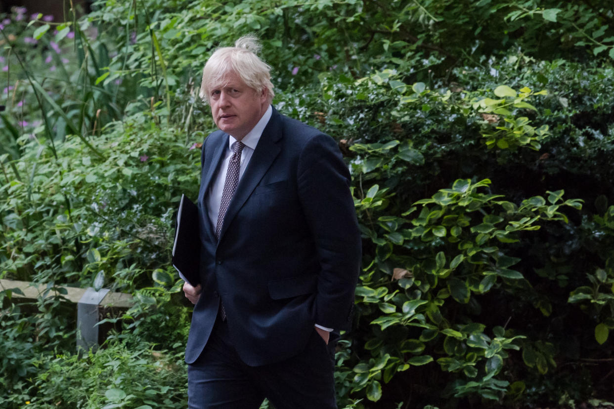 LONDON, UNITED KINGDOM - JULY 05, 2021: British Prime Minister Boris Johnson returns to 10 Downing Street after announcing lifting all of legal lockdown restrictions on July 19 as well as dropping mandatory measures on face masks and social distancing on July 05, 2021 in London, England. (Photo credit should read Wiktor Szymanowicz/Barcroft Media via Getty Images)