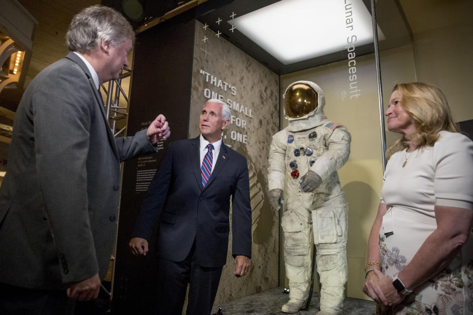 From left, Rick Armstrong, the son of Neil Armstrong, Vice President Mike Pence, and Smithsonian's National Air and Space Museum Director Ellen Stofan, speak together after unveiling Neil Armstrong's Apollo 11 spacesuit at the Smithsonian's National Air and Space Museum on the National Mall in Washington, Tuesday, July 16, 2019. (AP Photo/Andrew Harnik, Pool)