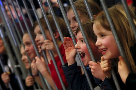 Children react to Hillary Clinton as she leads a campaign rally at Winnacunnet High School in Hampton, New Hampshire. REUTERS/Adrees Latif