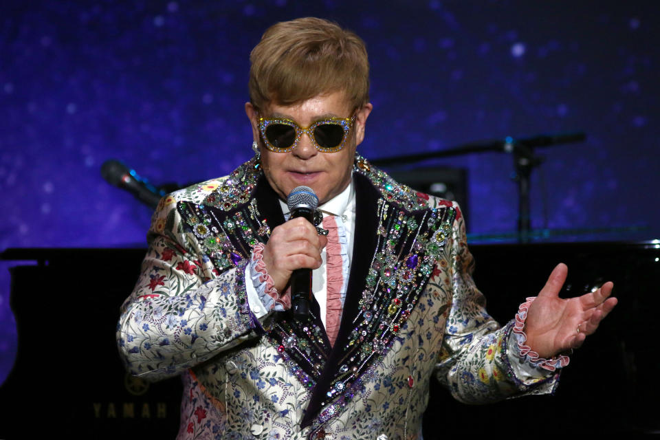 Elton John appears makes an appearance to announce that he will be retiring from touring after his next tour at an event at Gotham Hall in New York. 