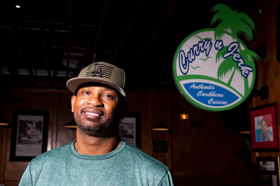 Arturo Azcarate, the owner of Curry N Jerk, poses for a portrait inside the new location of his restaurant at the Bon Ton Cafe in Downtown Memphis, on Tuesday, August 22, 2023.