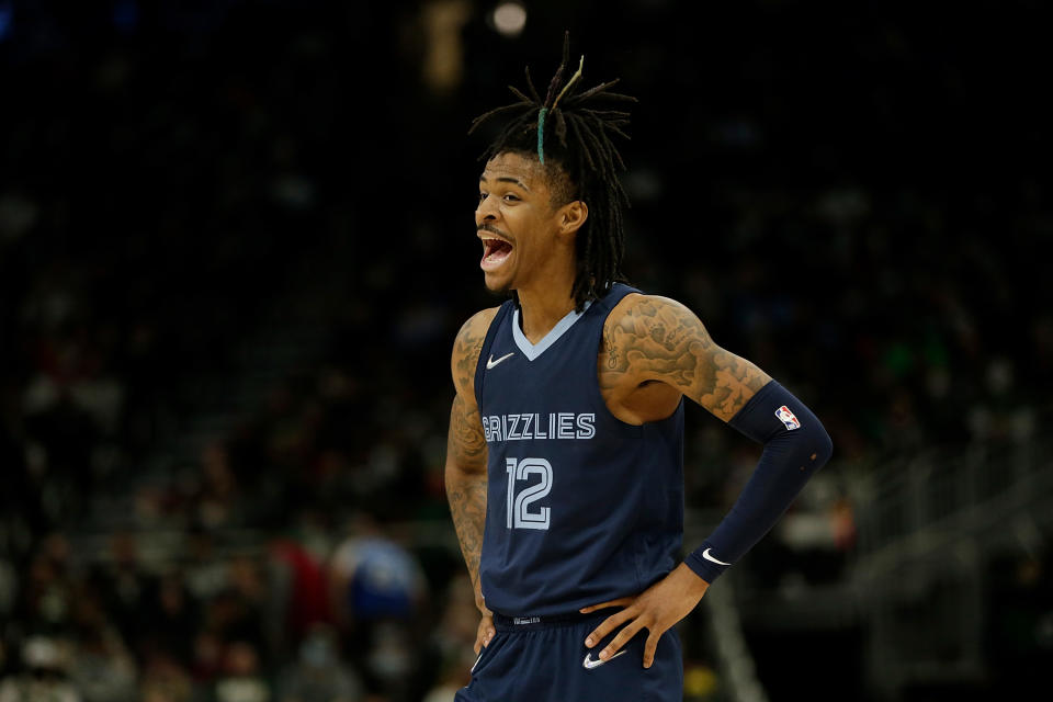 MILWAUKEE, WISCONSIN - JANUARY 19: Ja Morant #12 of the Memphis Grizzlies laughs after talking with a teammate during the second half against the Milwaukee Bucks at Fiserv Forum on January 19, 2022 in Milwaukee, Wisconsin. NOTE TO USER: User expressly acknowledges and agrees that, by downloading and or using this photograph, User is consenting to the terms and conditions of the Getty Images License Agreement. (Photo by John Fisher/Getty Images)