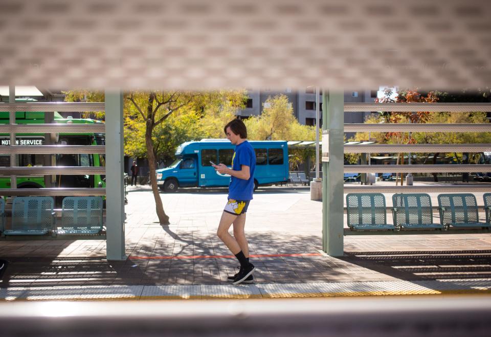 A man in Simpsons boxers waits for the light rail during the No Pants Light Rail Ride put on by Improv AZ Sunday, Jan. 12, 2020 ending at The Churchill in downtown Phoenix.