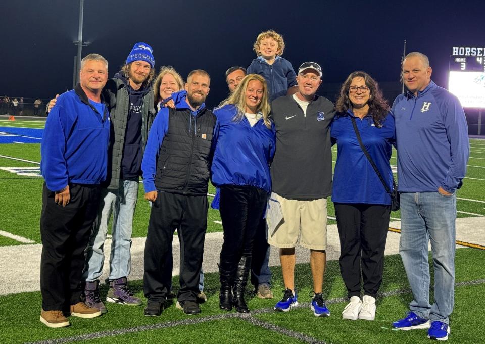 Horseheads Hall of Fame inductees with family and friends at a halftime ceremony Sept. 29, 2023 during the football game between Elmira and Horseheads at Horseheads High School.