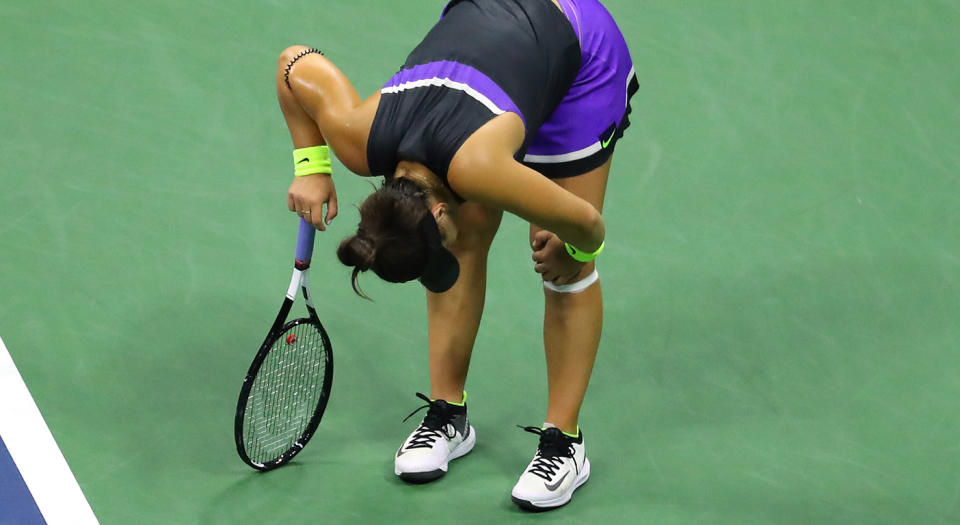 NEW YORK, NEW YORK - SEPTEMBER 05: Bianca Andreescu of Canada grabs her knee during her Women's Singles semi-final match against Belinda Bencic of Switzerland on day eleven of the 2019 US Open at the USTA Billie Jean King National Tennis Center on September 05, 2019 in the Queens borough of New York City. (Photo by Mike Stobe/Getty Images) 