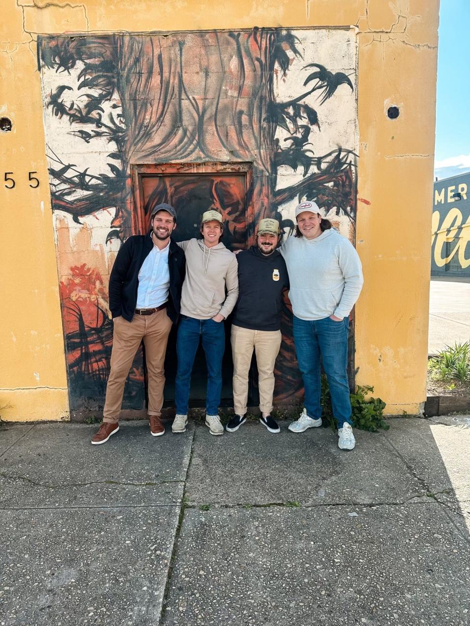 The co-owners of Hard Times Deli alongside project manager John Halford with cnct. designs (far left) who will construction the deli. Left to right: Cole Jeanes, Harrison Downing and Schuyler O’Brien.