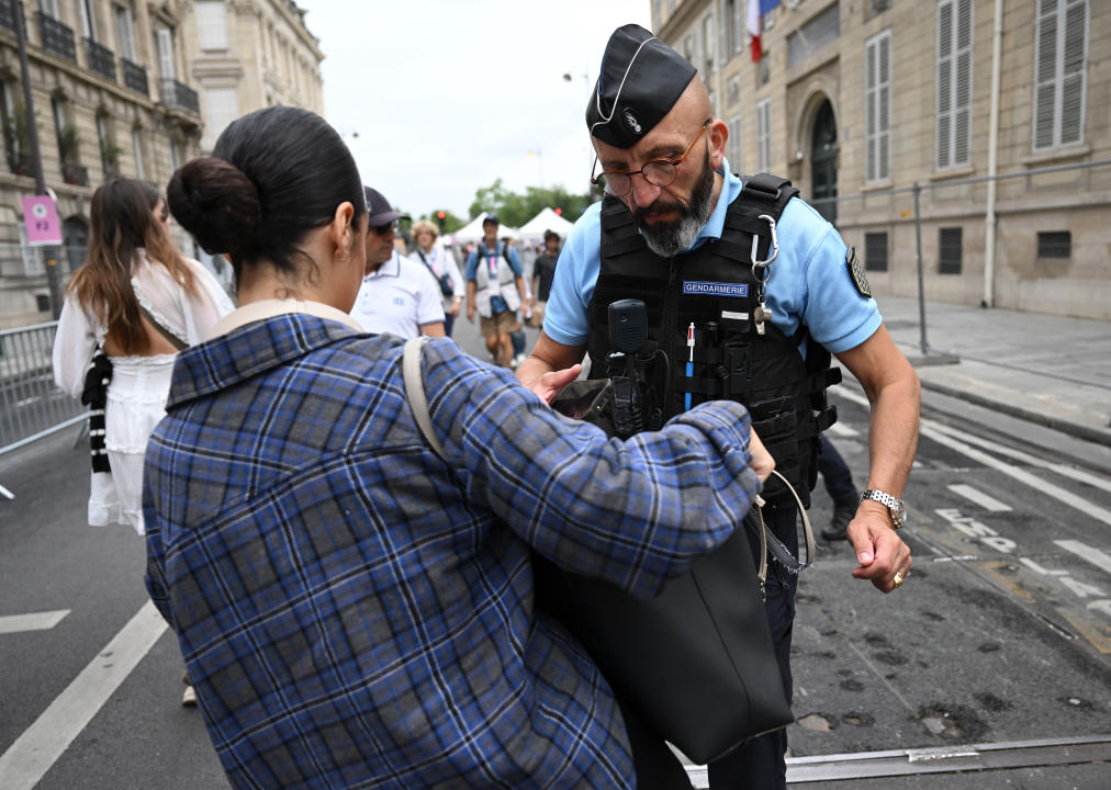 26 July 2024, France, Paris: Before the Summer Olympics, Olympia Paris 2024, Olympia, security forces check bags in front of an entrance to the opening ceremony. Photo: Marijan Murat/dpa (Photo by Marijan Murat/picture alliance via Getty Images)