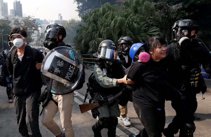 Protesters clash with riot police in the campus of Hong Kong Polytechnic University in Hong Kong