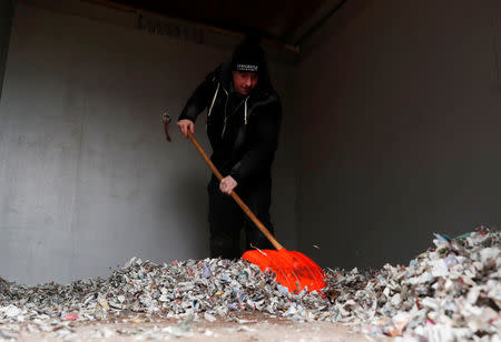 Horse Racing - Newcastle - Newcastle Racecourse, Newcastle upon Tyne, Britain - February 8, 2019 General view of the stables being cleaned by a memeber of staff at the racecourse after the meeting is cancelled following the confirmed outbreak of equine flu Action Images via Reuters/Lee Smith