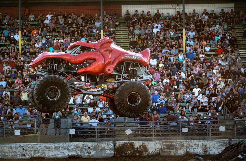 A large crowd watches the monster truck race at the 2022 Stanislaus County Fair.