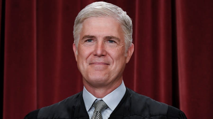 Associate Justice Neil Gorsuch joins other members of the Supreme Court as they pose for a new group portrait