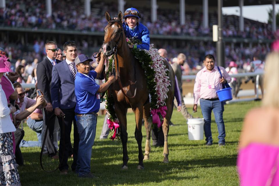 Tyler Gaffalione smiles aboard Pretty Mischievous after the filly won the 149th Kentucky Oaks at Churchill Downs.