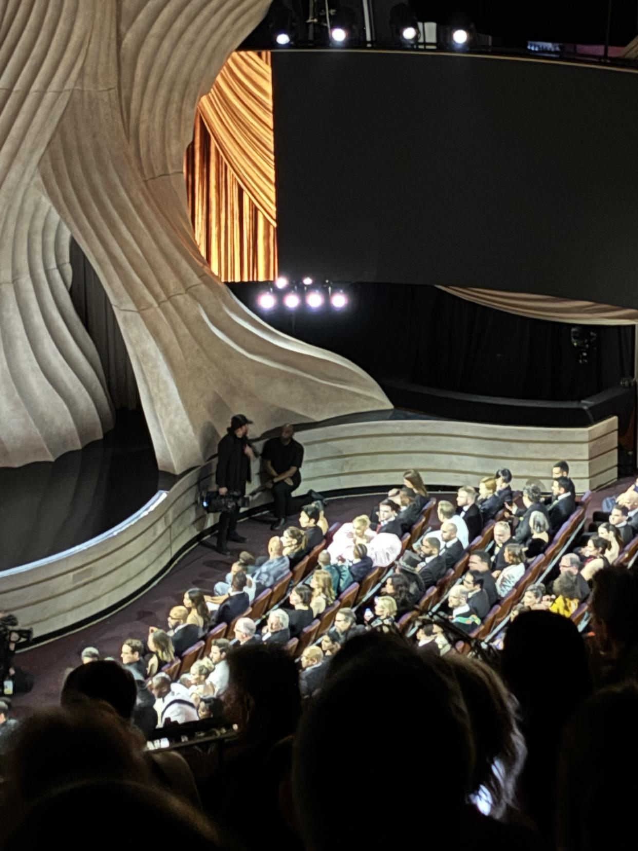 Ariana Grande's dress can't be missed in the audience at the Oscars.