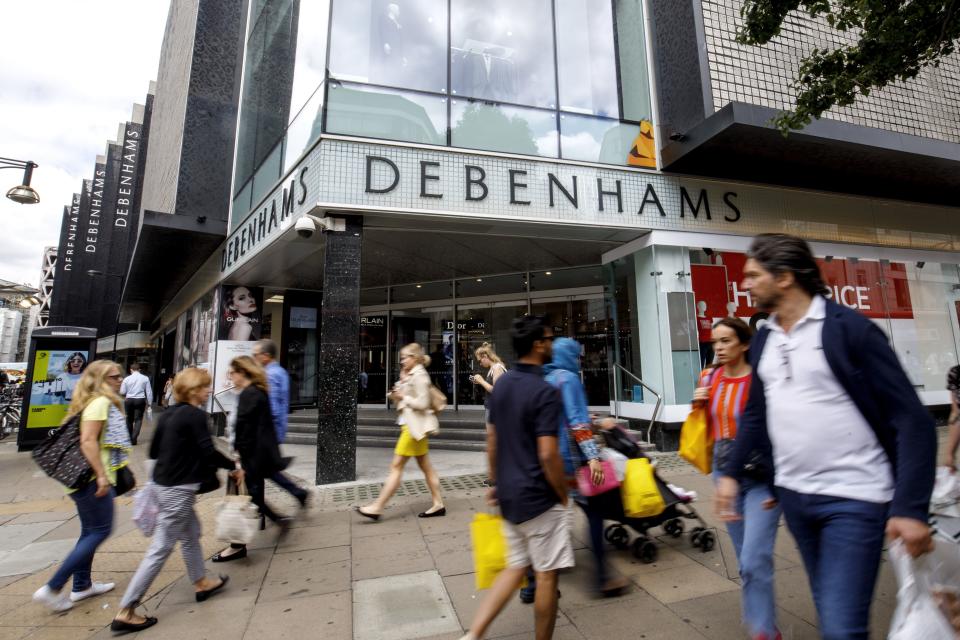 Shoppers walk past a Debenhams shop in Oxford Street, central London on June 19, 2018. Photo: TOLGA AKMEN/AFP/Getty Images